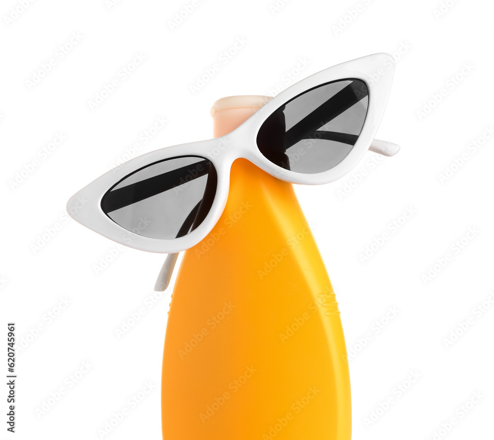 Creative composition with stylish sunglasses and bottle of sunscreen cream isolated on white backgro