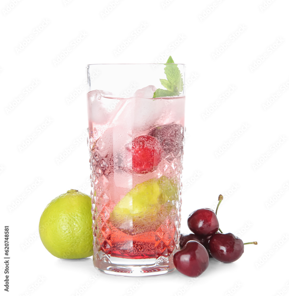 Glass of tasty cherry lemonade with lime and mint on white background