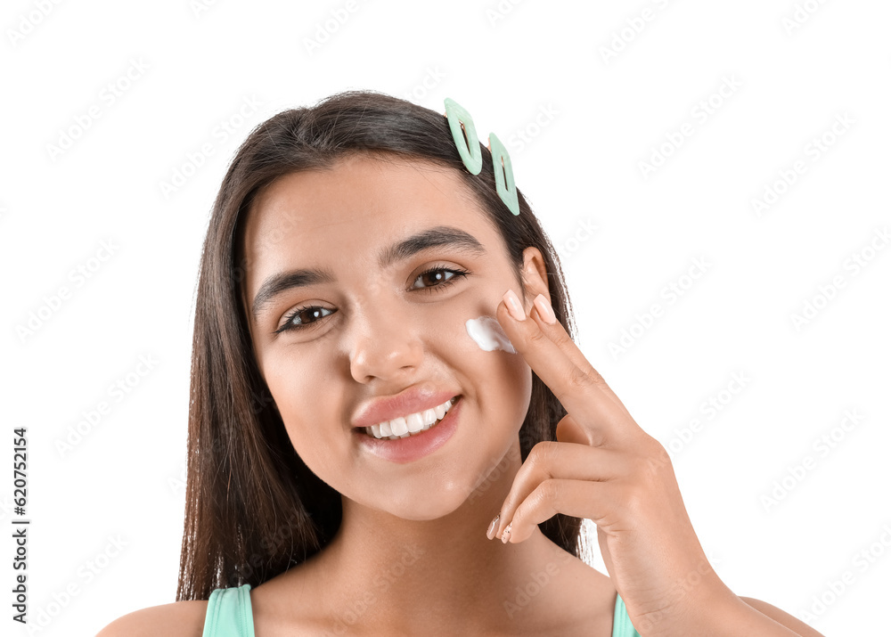 Beautiful young woman applying sunscreen cream on white background, closeup