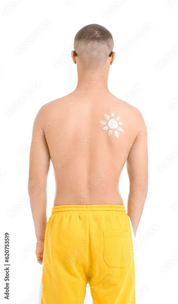 Young man with sun made of protection cream on his body against white background, back view