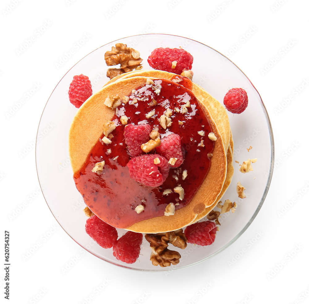 Plate of tasty pancakes with raspberries and nuts on white background