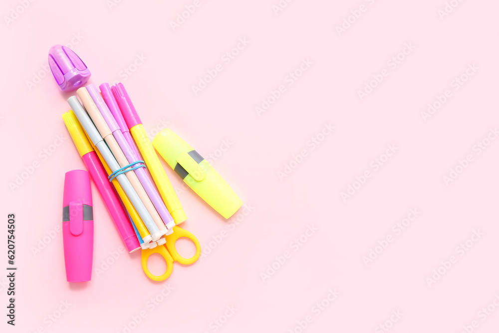 Stationery in shape of rocket on pink background