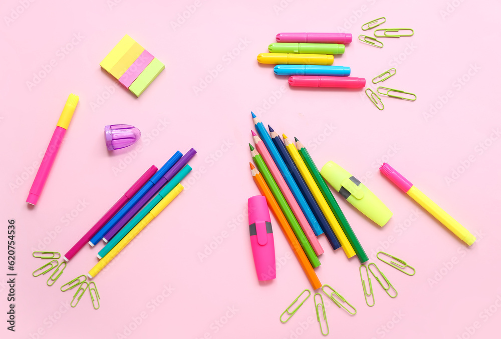 Stationery in shape of rocket on pink background