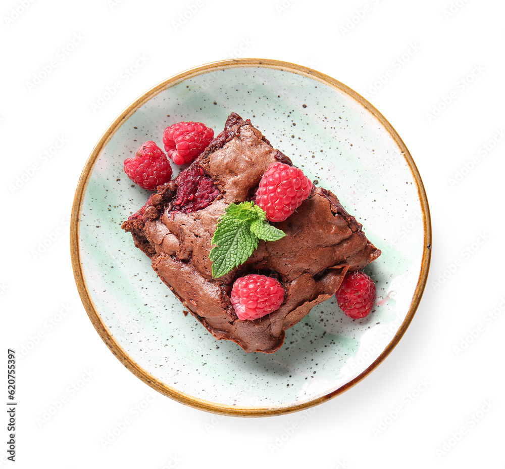 Plate with piece of raspberry chocolate brownie on white background