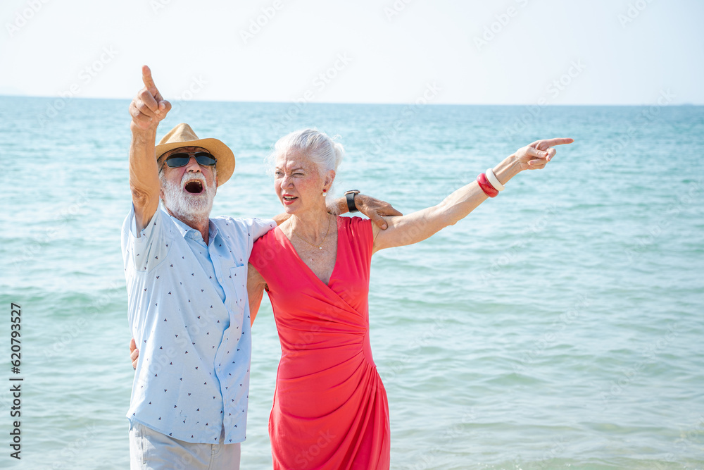 Mature couple hug and walk together with happy moment on beach, Comic memory or conversation by sea,