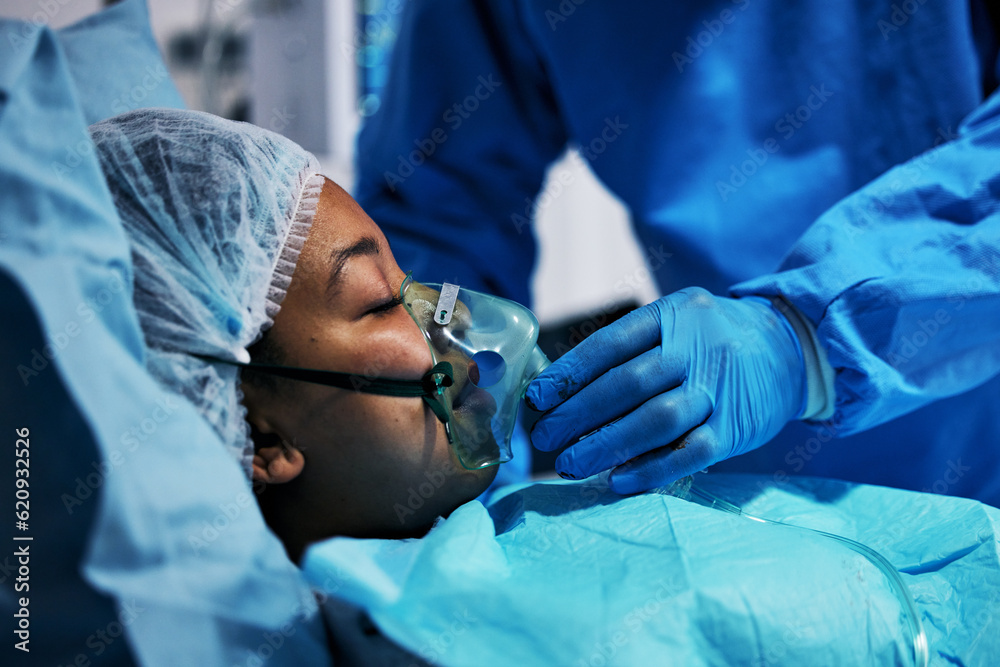 Healthcare, doctor and patient in oxygen mask for surgery, emergency care and hospital bed. Breathin