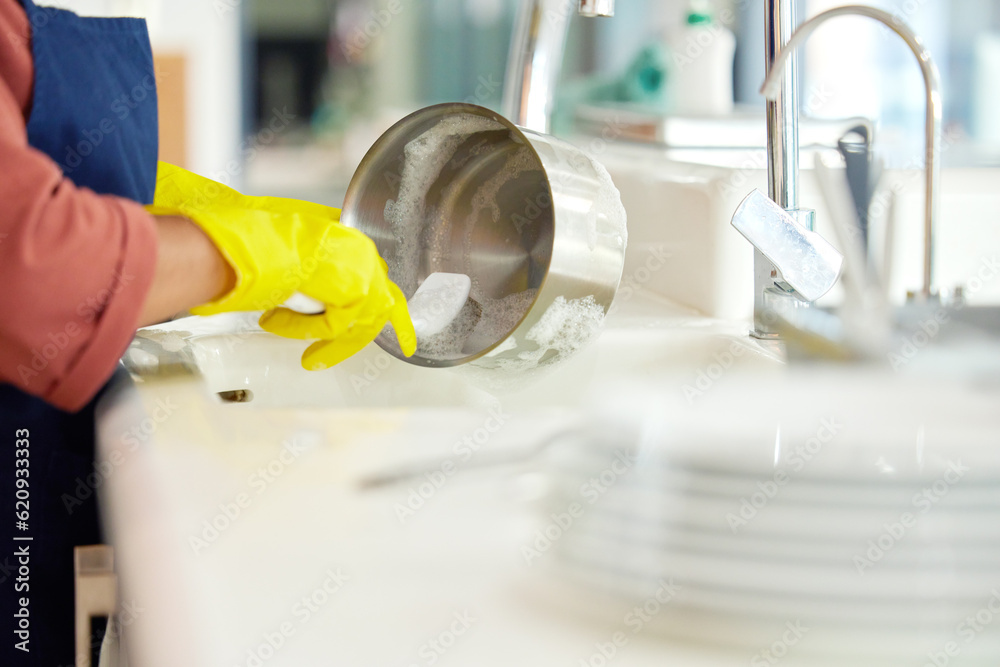 Hands of woman, gloves and washing dishes in kitchen, brush chores and house work, cleaner service a