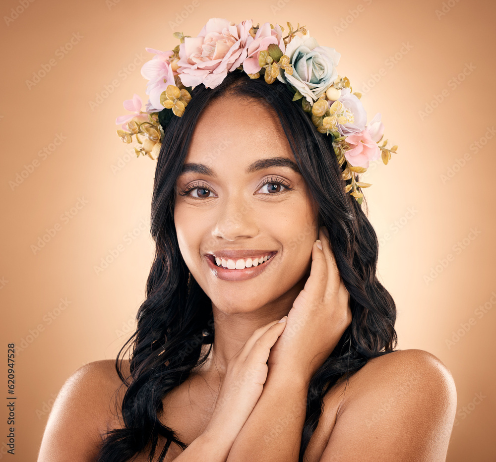 Portrait, smile and flower crown with a model woman in studio on a brown background for shampoo trea