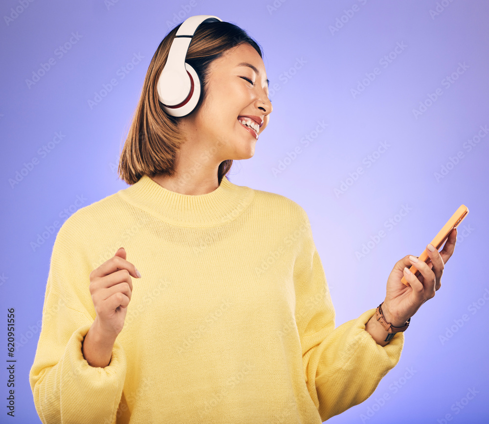 Music, phone and happy Asian woman in studio for social media, internet meme and online chat. Headph