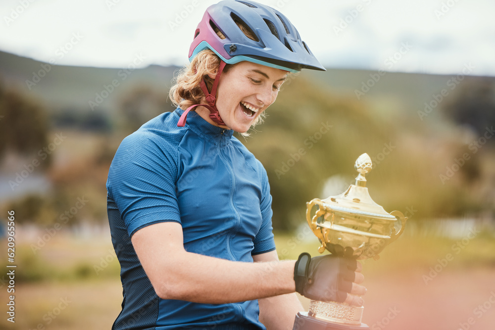 Winner, trophy and achievement with a woman cyclist in celebration of victory outdoor after a race. 