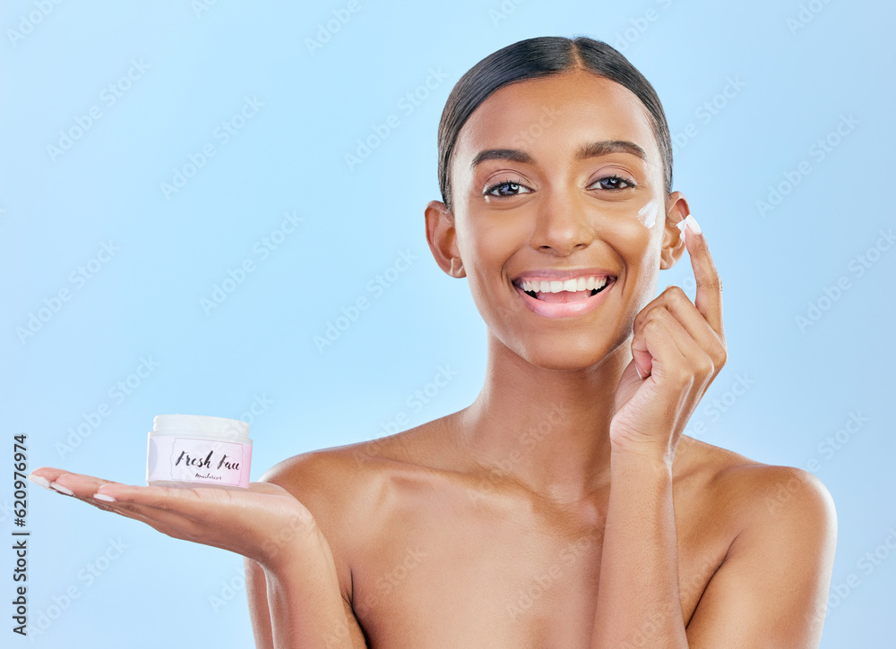 Face cream, skin and beauty portrait of a happy woman with natural glow on a blue background. Dermat