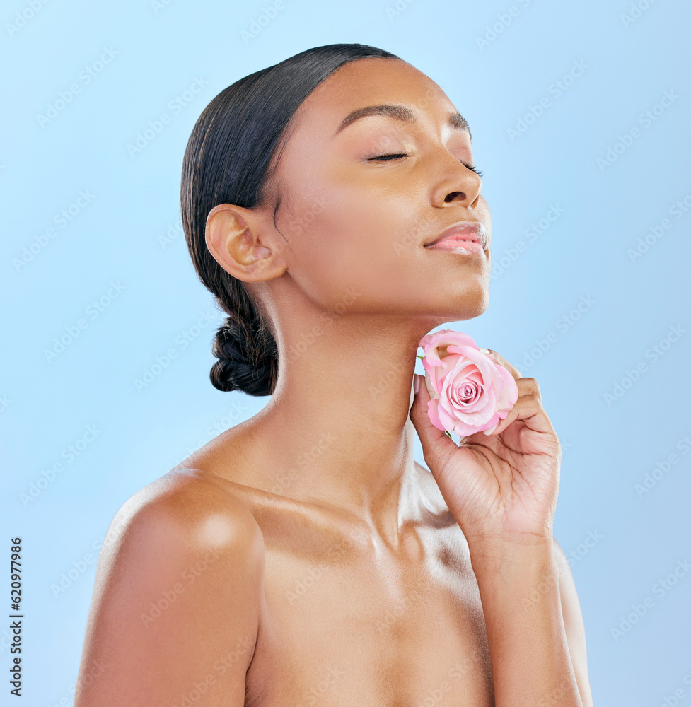 Woman, rose and beauty with natural cosmetics and eco friendly skincare on blue background. Flower, 