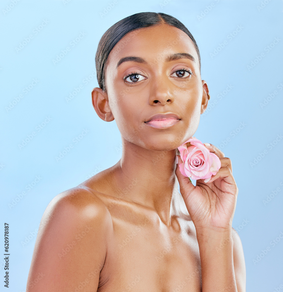 Woman, rose and natural beauty with cosmetics and eco friendly skincare on blue background. Flower, 