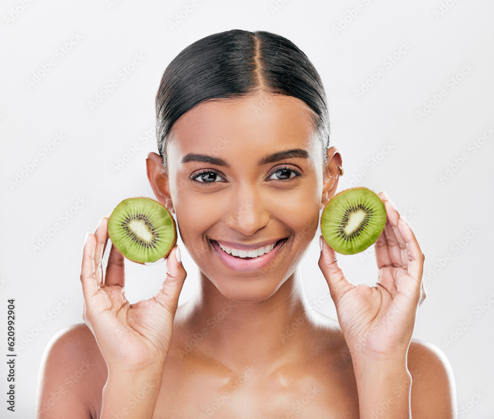 Skincare, health and portrait of a woman with kiwi for nutrition, diet and wellness. Happy, spa trea