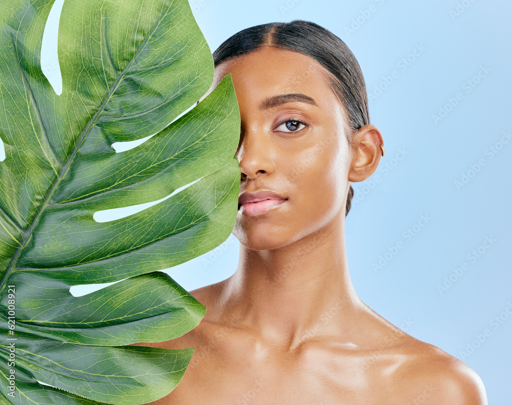 Skincare, plant and portrait of a woman on a blue background for skincare, wellness and beauty glow.