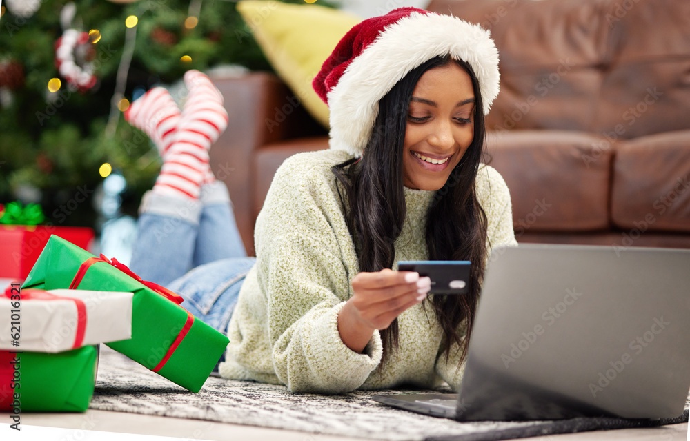 Christmas, online shopping and woman with laptop, credit card for payment for gift with internet ban