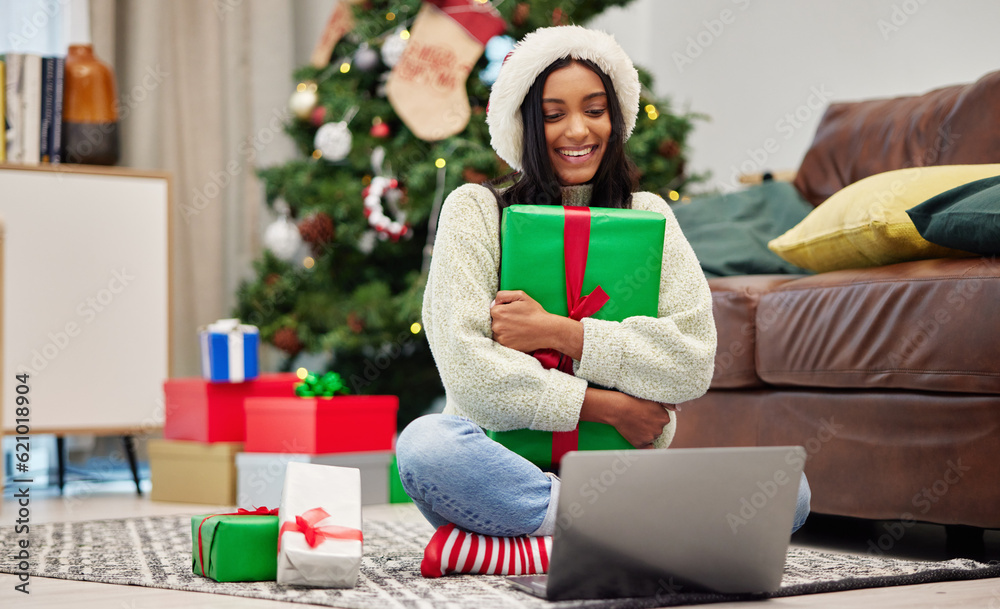 Woman, Christmas present and laptop, video call and celebrate holiday, happiness and communication. 