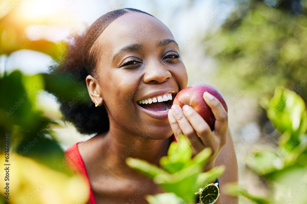 Apple, health and portrait of a black woman biting a fruit on a farm with fresh produce in summer an