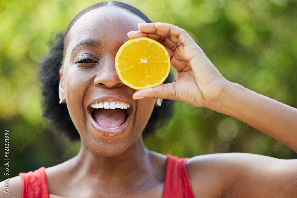 Happy black woman, face and orange for vitamin C, natural nutrition or citrus diet in nature outdoor