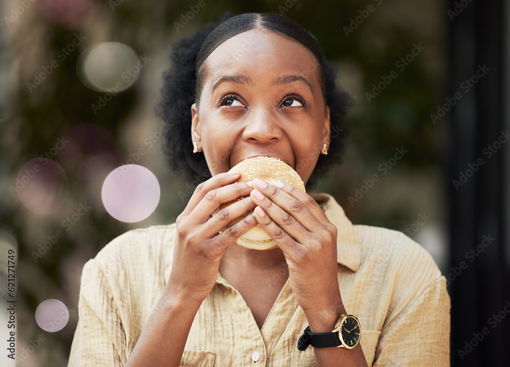 Thinking, fast food and black woman biting a burger in an outdoor restaurant as a lunch meal craving