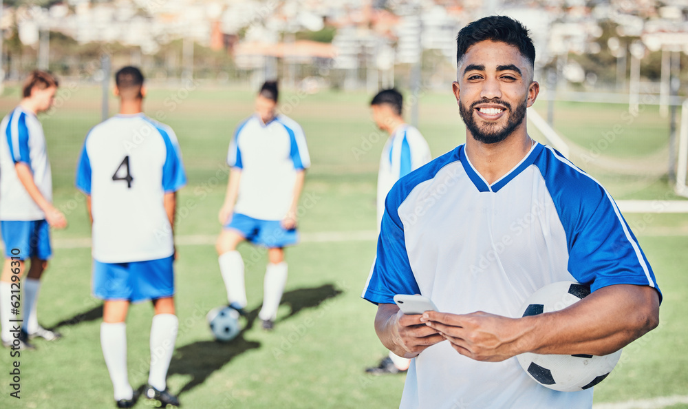 Football player, phone and portrait at game on a field for sports and fitness app. Happy male soccer