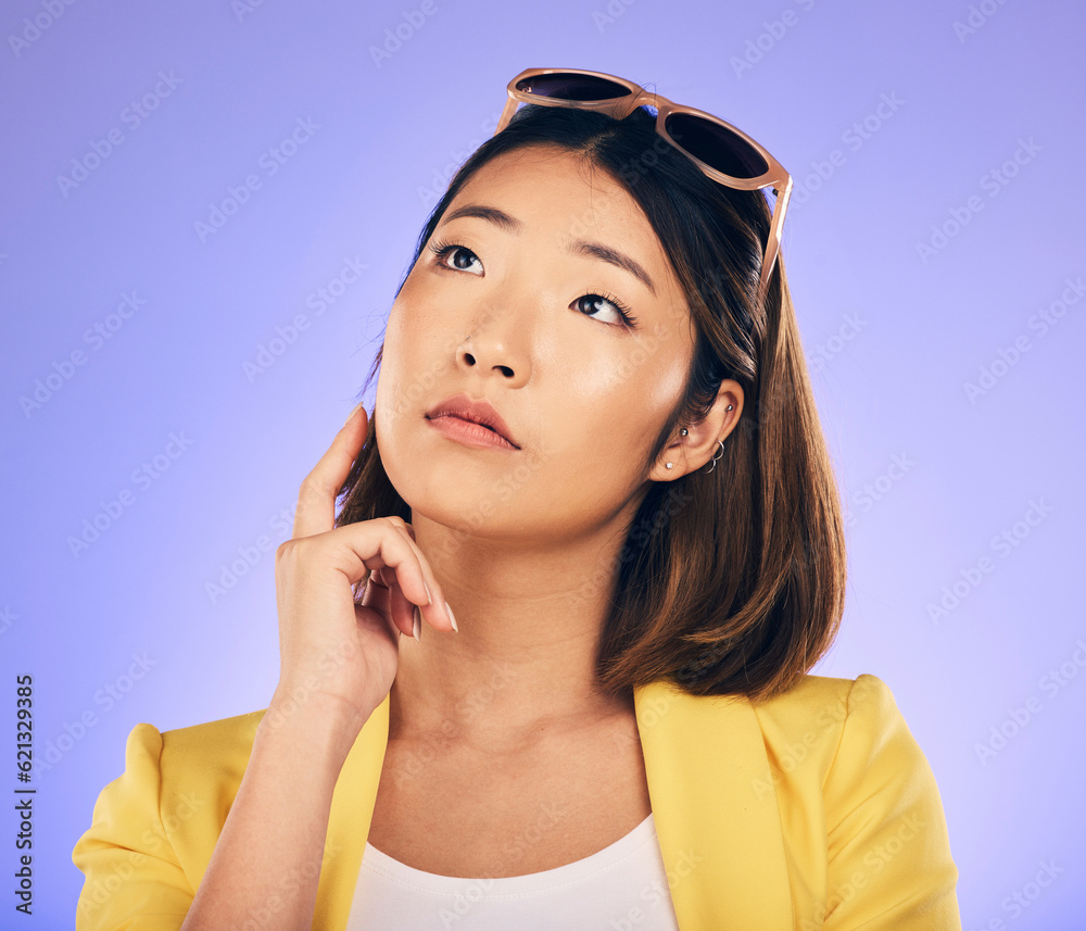 Thinking, glasses and wondering with asian girl or idea in purple background in studio with decision