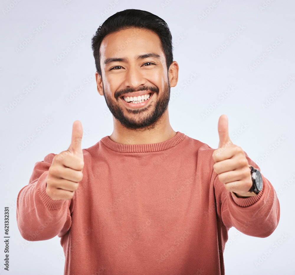 Thumbs up, portrait and man support for success in studio, white background and winning news. Happy 