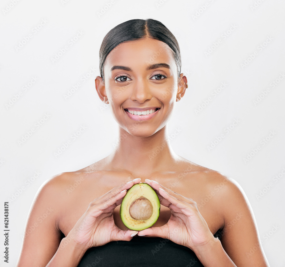 Woman, beauty and avocado in studio portrait for health, wellness and diet for facial glow by white 