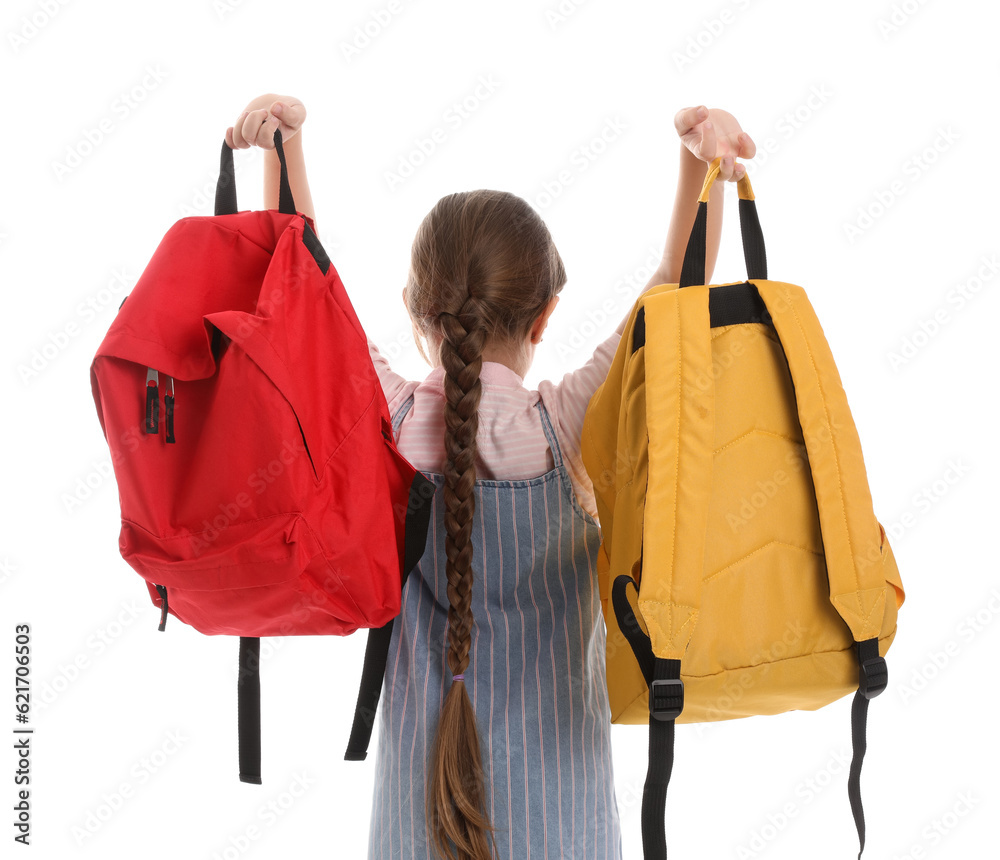 Little schoolgirl with backpacks on white background, back view