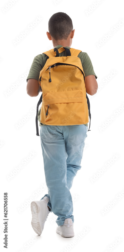 Little African-American schoolboy with backpack on white background, back view