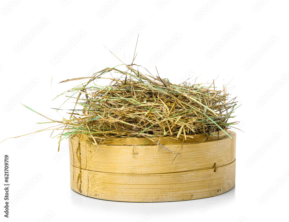 Straw in crate on white background