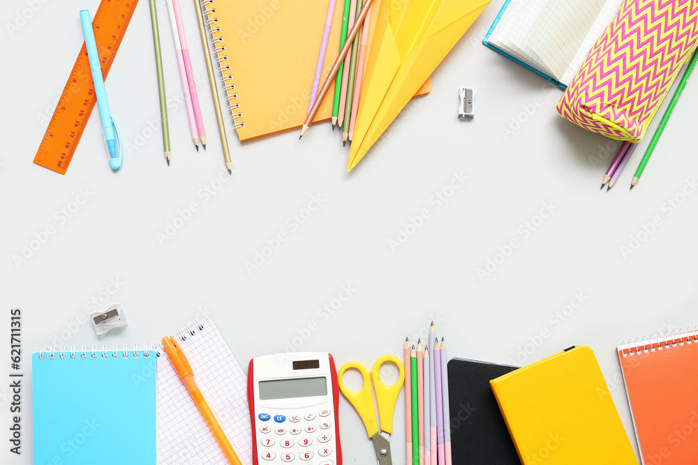 Paper plane and different school stationery on white background