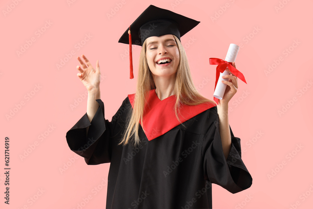 Female graduate student with diploma on pink background