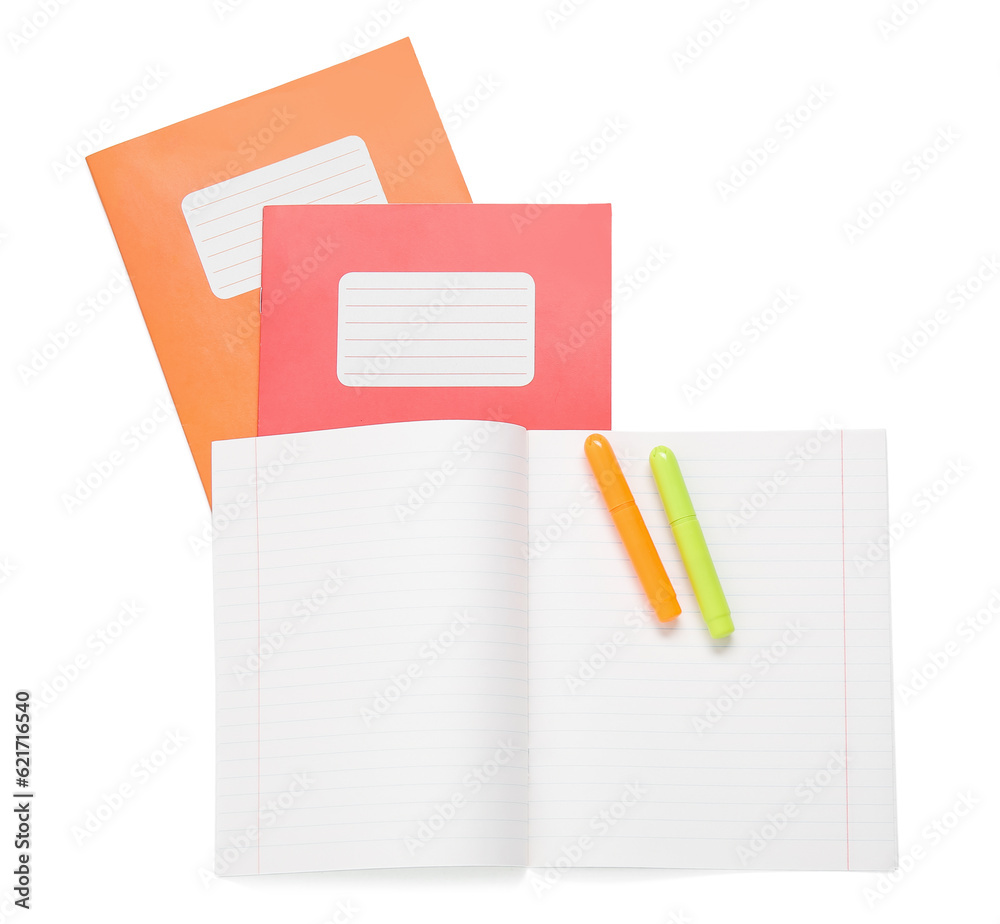 Different colorful notebooks with markers isolated on white background