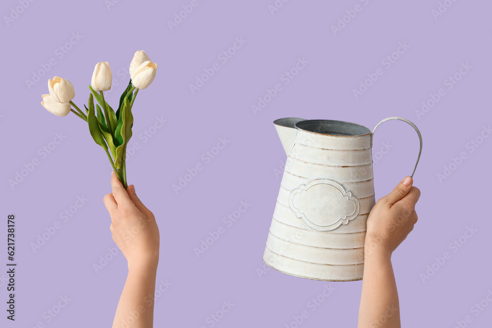 Gardener with tulips and watering can on lilac background