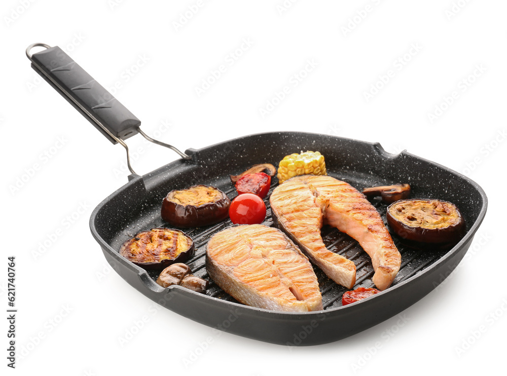 Frying pan with tasty grilled salmon steak and vegetables on white background