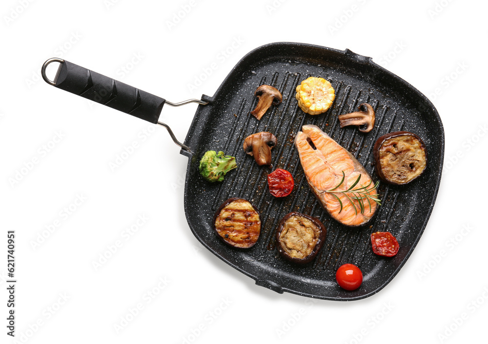 Frying pan with tasty grilled salmon steak and vegetables on white background