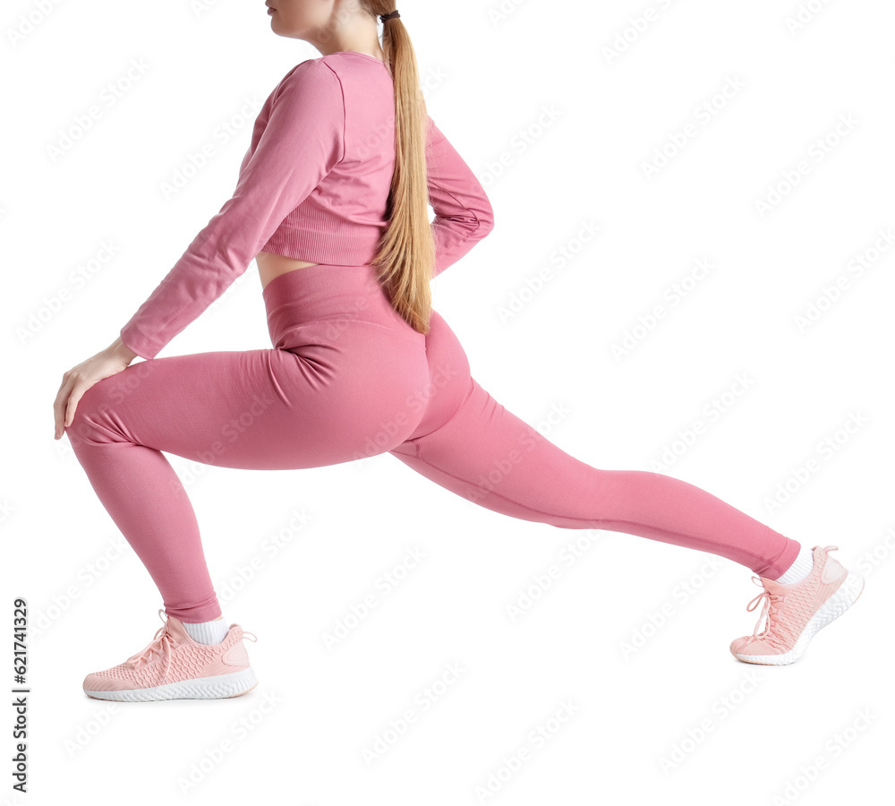 Young woman in sportswear on white background