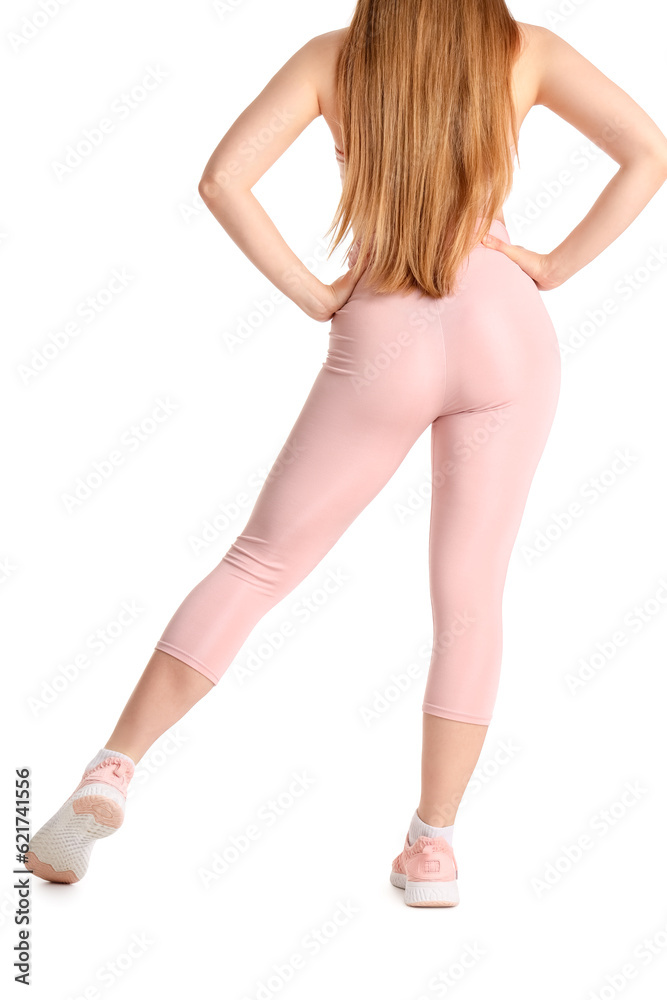 Young woman in sportswear on white background, back view