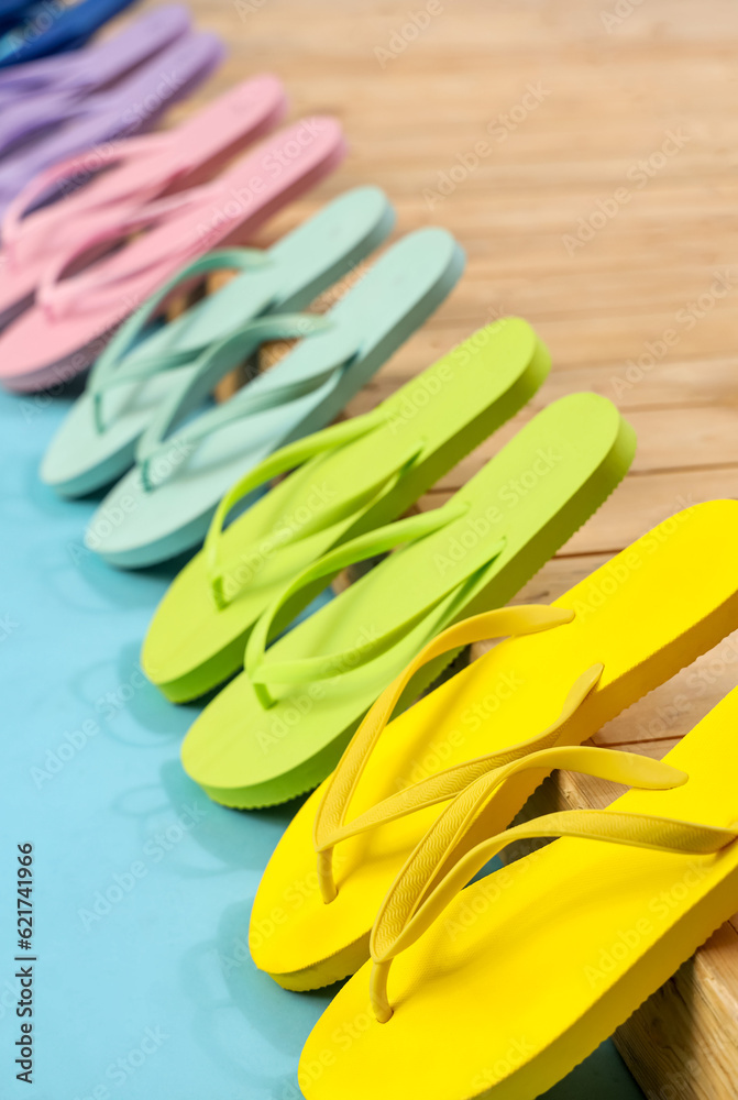 Many different flip-flops on blue background