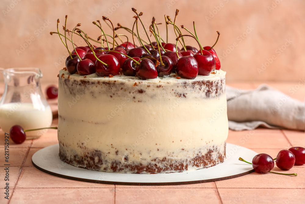 Tasty cherry cake on table