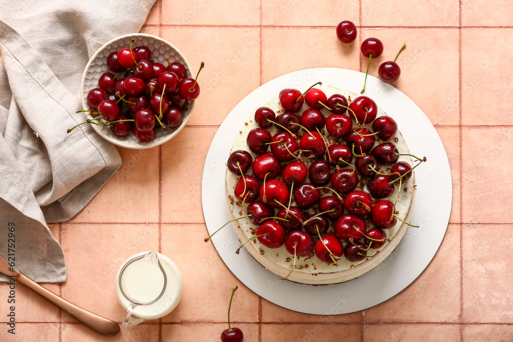 Tasty cherry cake on beige tile background