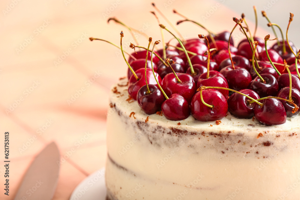 Tasty cherry cake on table