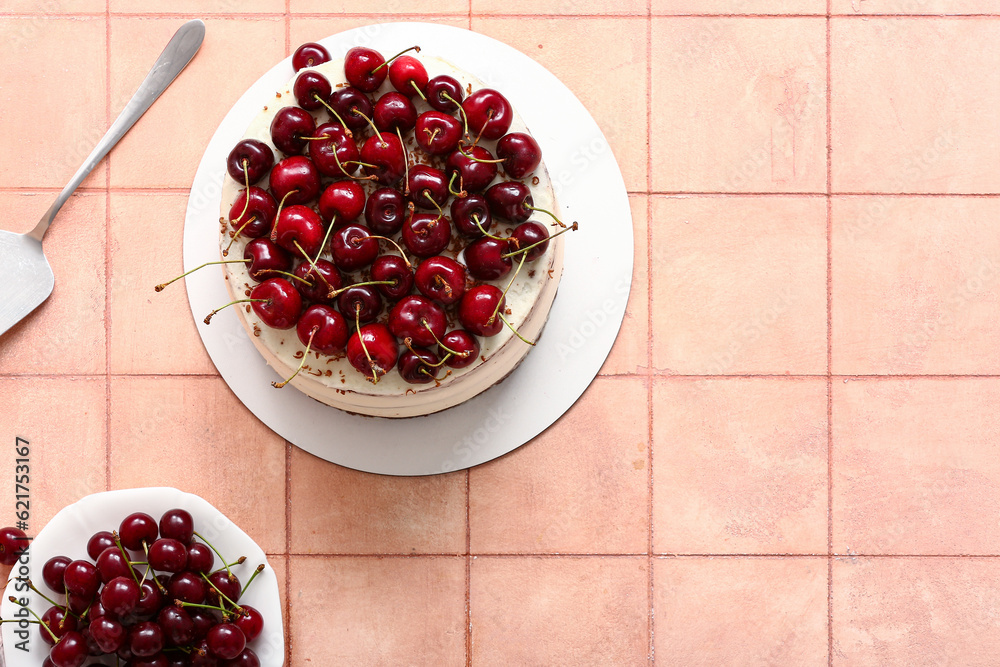 Tasty cherry cake on beige tile background