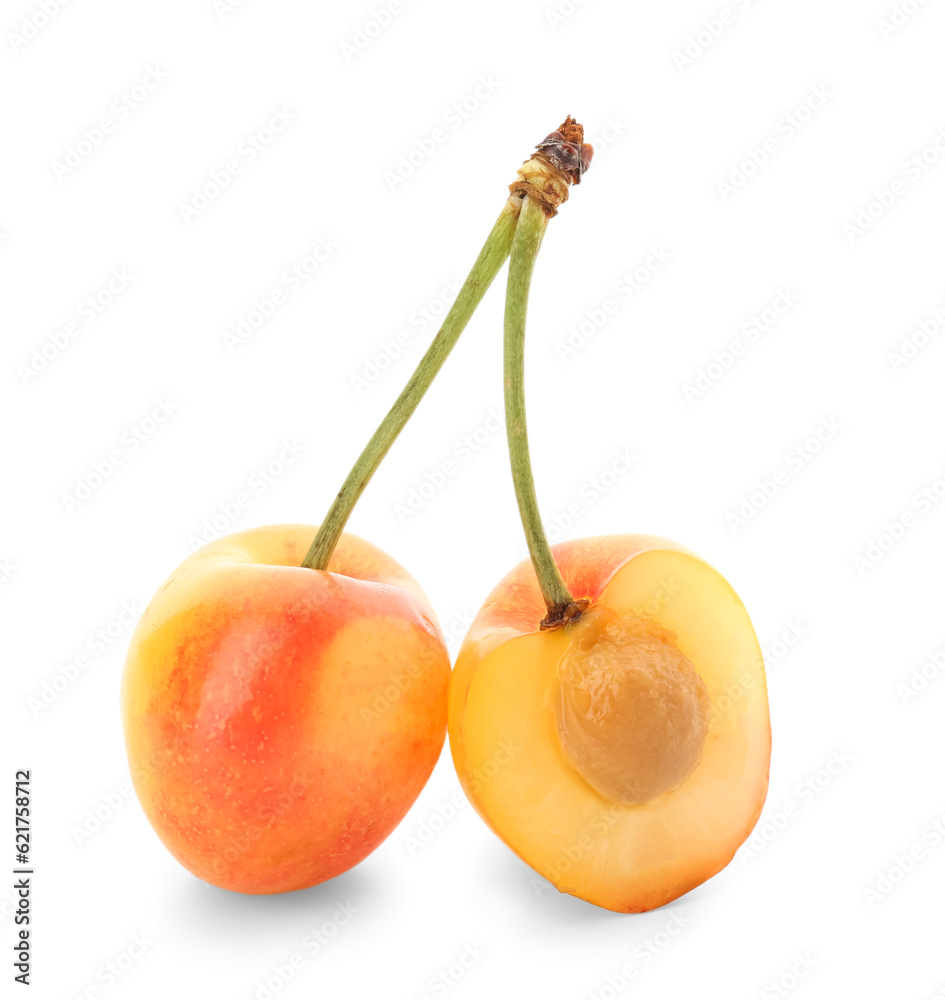 Sweet yellow cherry with half on white background