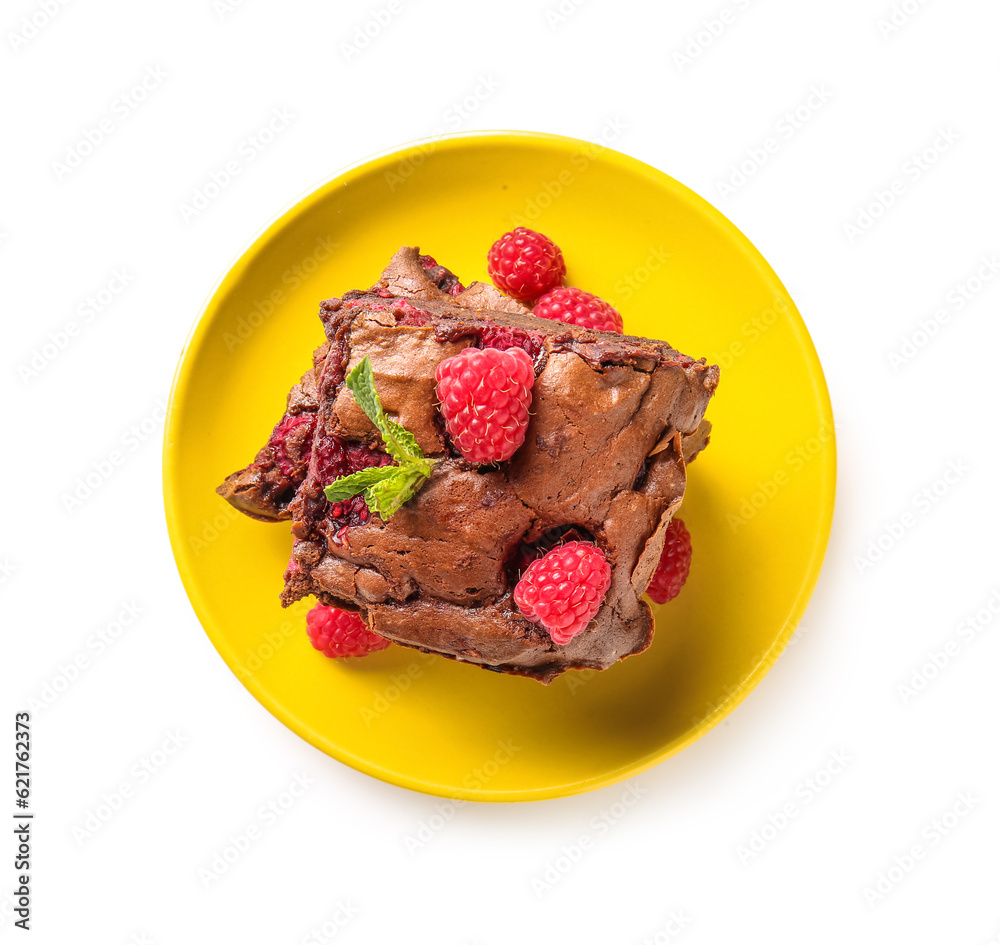 Plate with pieces of raspberry chocolate brownie on white background