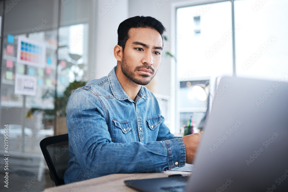 Thinking, laptop and man at desk reading email, feedback or research planning at design agency job. 