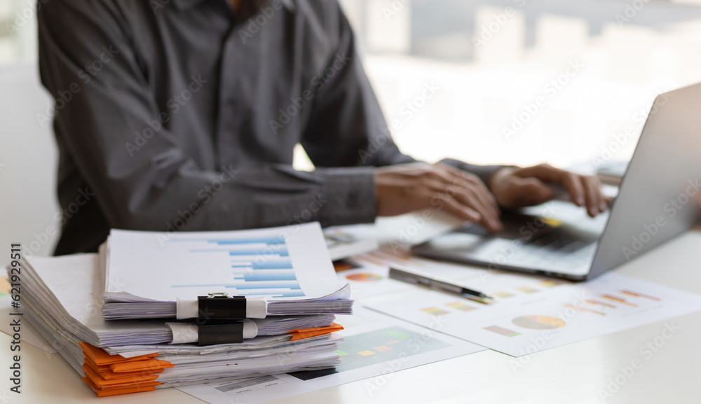 Business Documents, Auditor businessman checking working in stack of paper files for searching docum