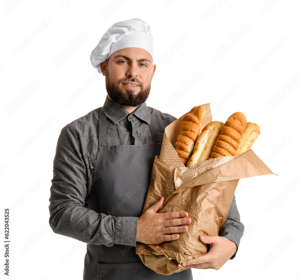 Male baker with fresh baguettes on white background