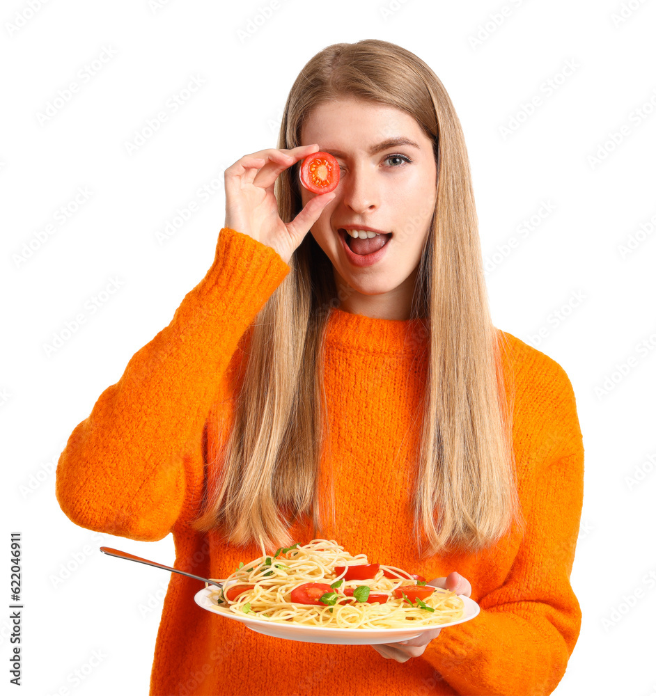 Young woman with tasty pasta and tomato on white background